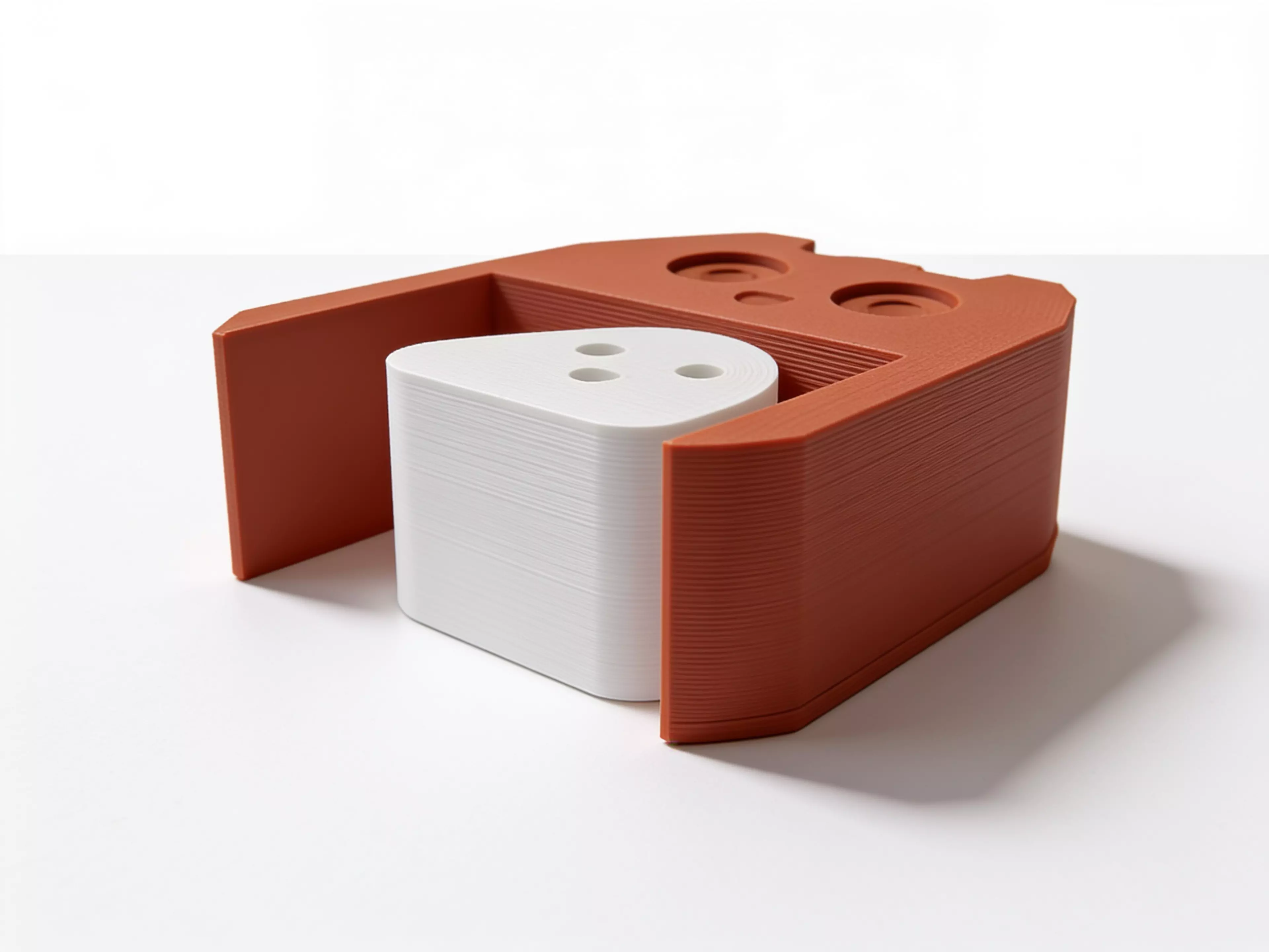 A palm-sized two-piece owl desk toy whose removable chick rolls beneath the belly to create a visible foot-to-foot change.