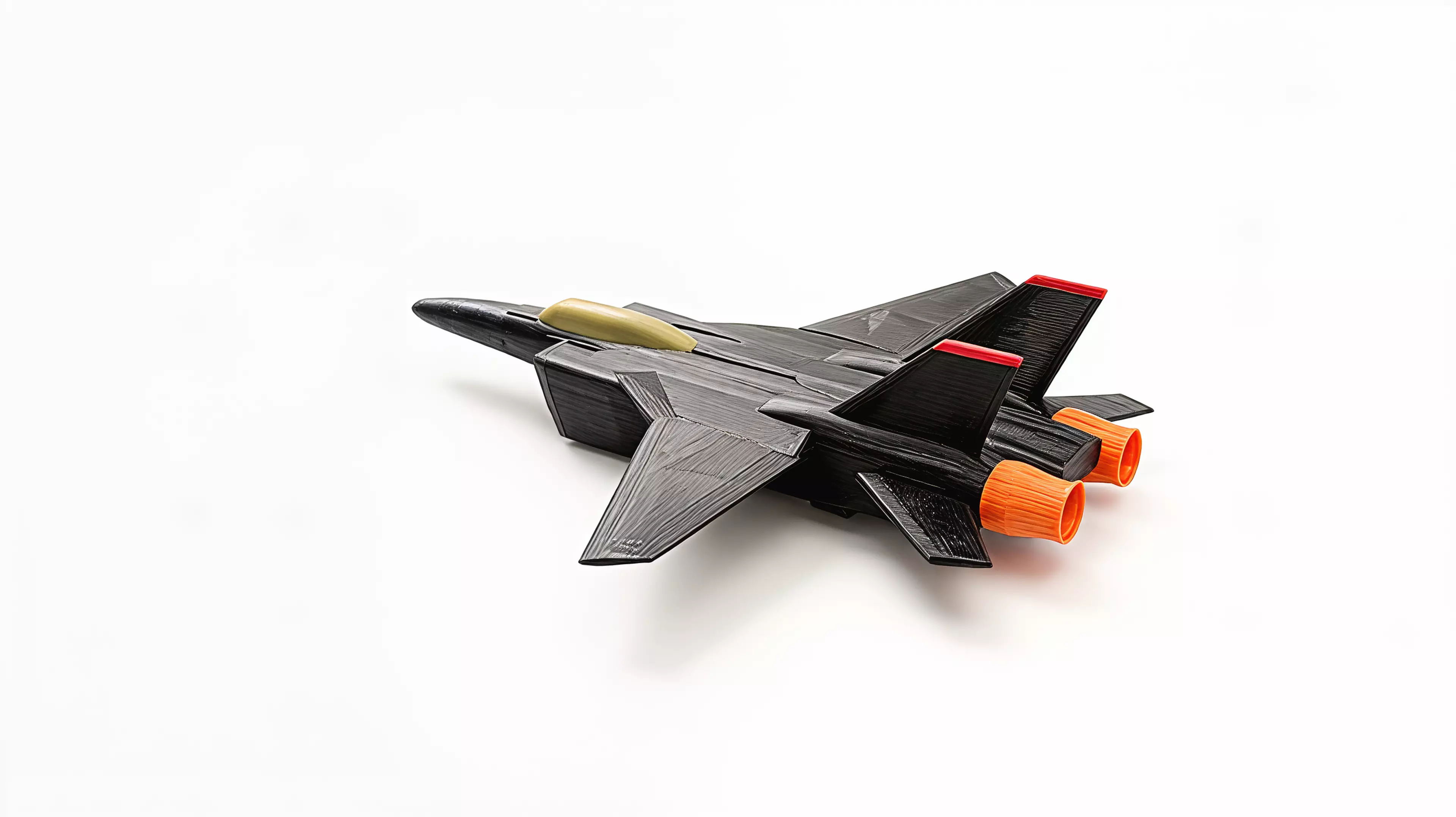 A 390 mm-wingspan F-14D Tomcat that sits on its own landing gear like a ramp-parked jet. Sixteen colour-separated printed parts - gloss-black airframe and spine deck, pale-khaki tandem canopy, red-tipped twin tails, red intake frames and nose strut, orange afterburner nozzles and a full tricycle gear - assemble into a spread-wing display pose. 390 x 388 x 117 mm (about 15.4 x 15.3 x 4.6 in).