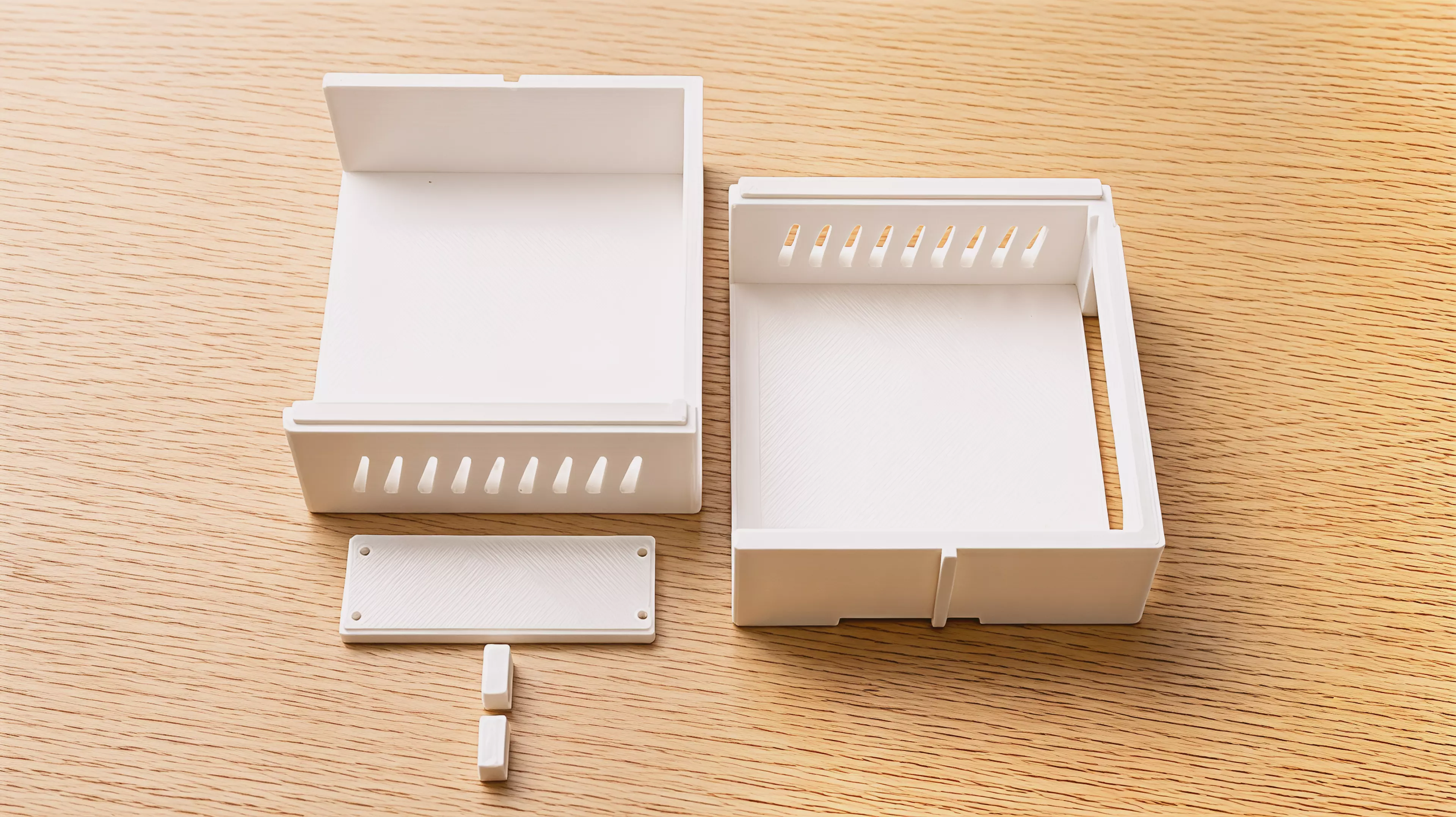 A modular rack tier for two NVIDIA DGX Spark nodes side-by-side, built as left + right halves tied by a slide-in dovetail plate, with male dovetail rails on top and female slots underneath so identical tiers slide-stack from the rear and lock with rear thumb-screw stop keys — in the chosen soft…