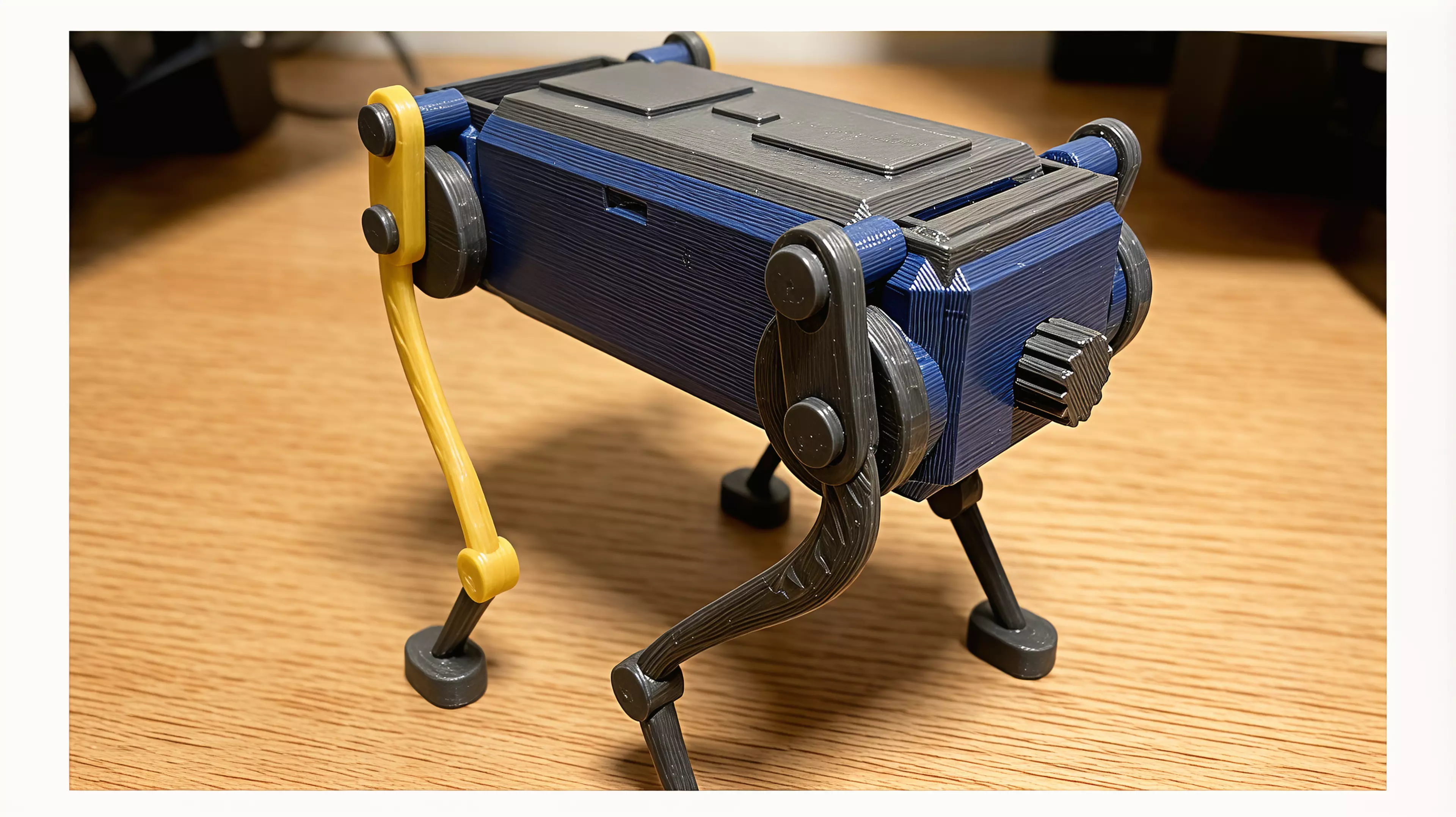 A palm-size wind-up walker. Twist the knob at the back to wind it up, set it down, and it trots forward on four legs with a smooth, life-like gait - no batteries, no motors. The rubber band inside drives two crankshafts that swing the legs in turn, so it keeps its balance step after step. Every part is 3D printed.