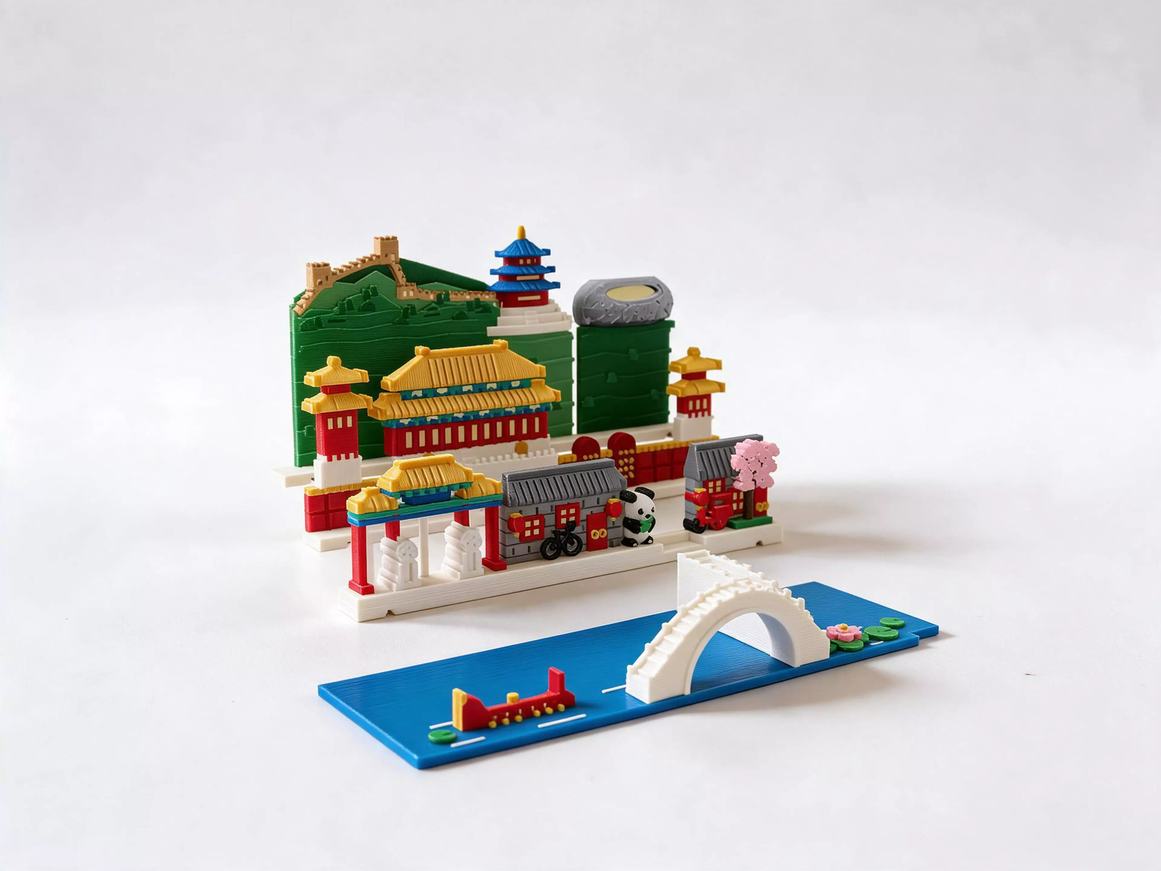 A Beijing city pack for the Moonlit Atlas pop-up book: three magnetic landmark rows and a Houhai water plate. Includes the Great Wall, Temple of Heaven, Forbidden City palace facades, Bird's Nest stadium, hutong houses, a panda and an arched bridge. This pack contains the Beijing city only. The Moonlit Atlas book is required and sold separately; the book, cover, pop-up frames and mechanism are not included.