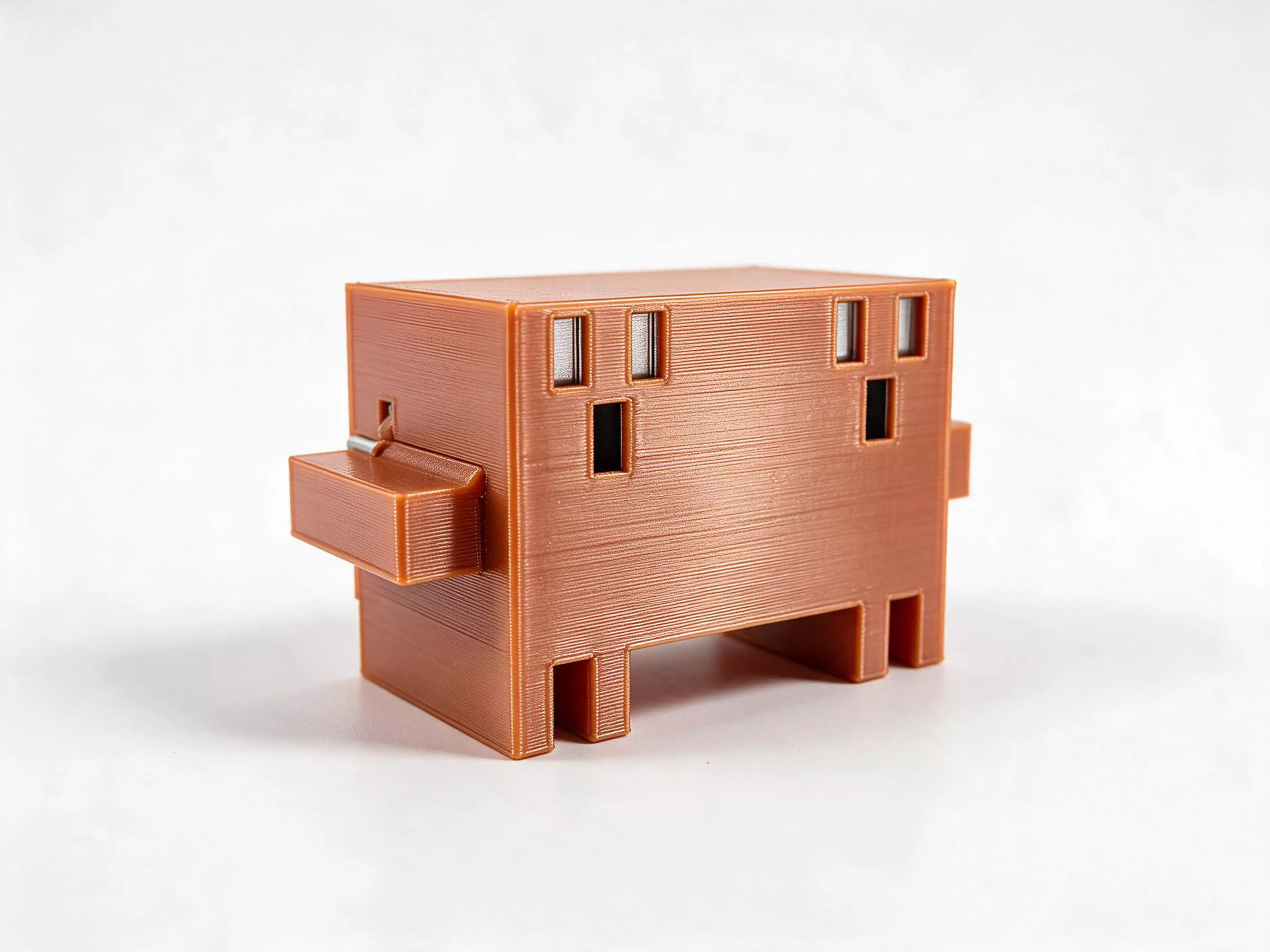 A pixel-art crab with a dial on its back. Turn the knob and it clicks through four poses: eyes ahead, look left, look right and arms up. It turns all the way round in either direction. About 4.7 in wide, made from PETG in clay orange with black eyes.
