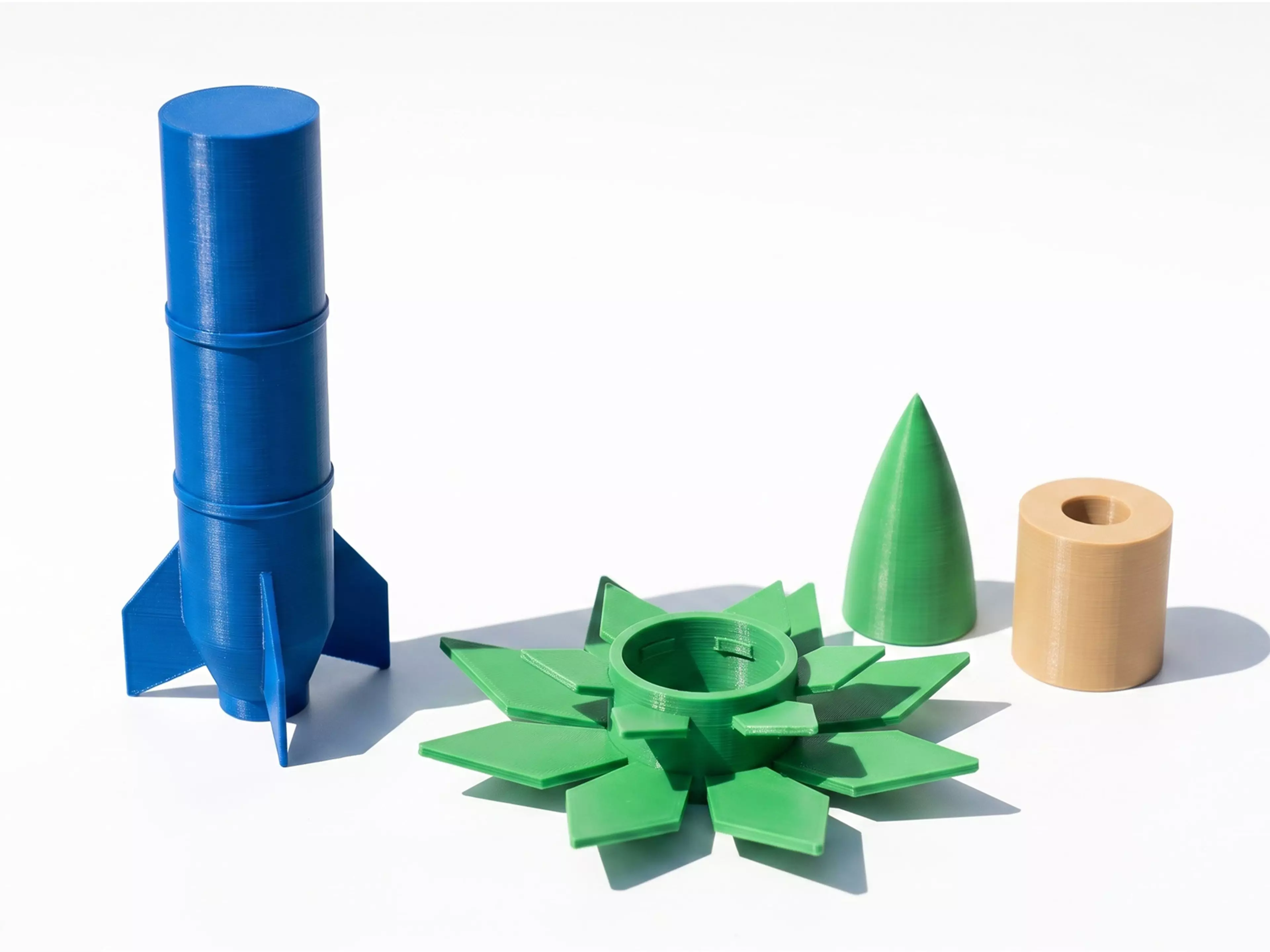 A one-of-a-kind 180 mm-tall display piece: a classic retro finned rocket that plugs into an open-bloom lotus-flower pedestal base — two separate, removable parts, each a different color.