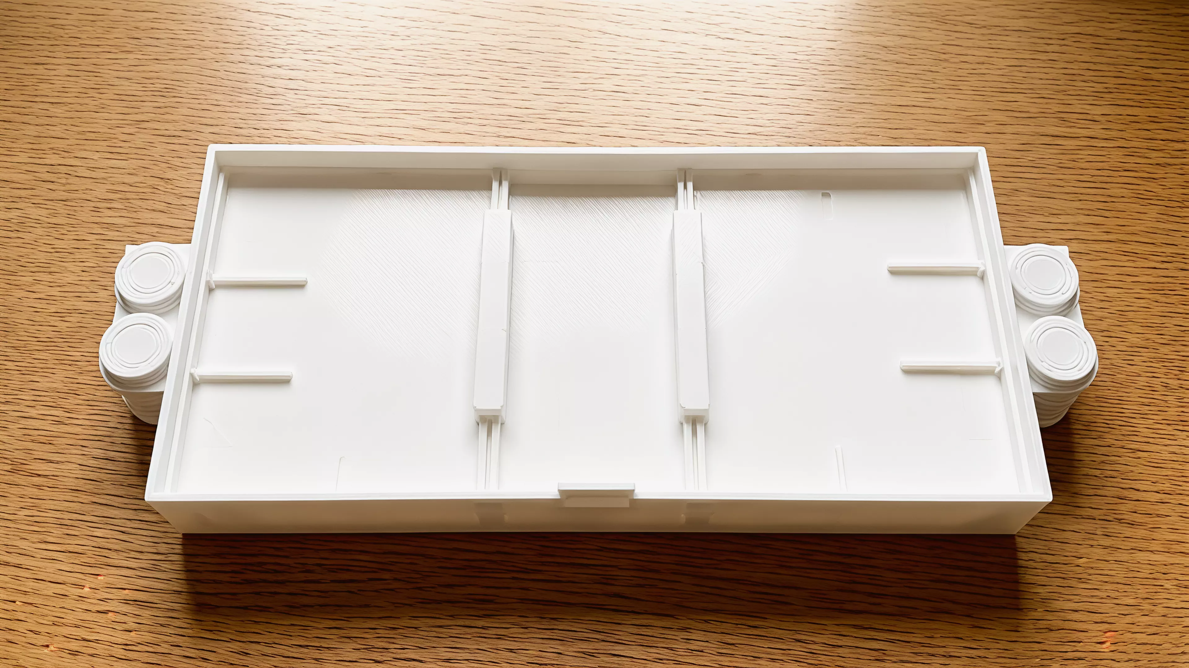 A portable, all-printed tabletop dexterity game for one or two players: pulse two gravity gates, flick a comet through both portals, and bank into pip-marked vaults across six shots.