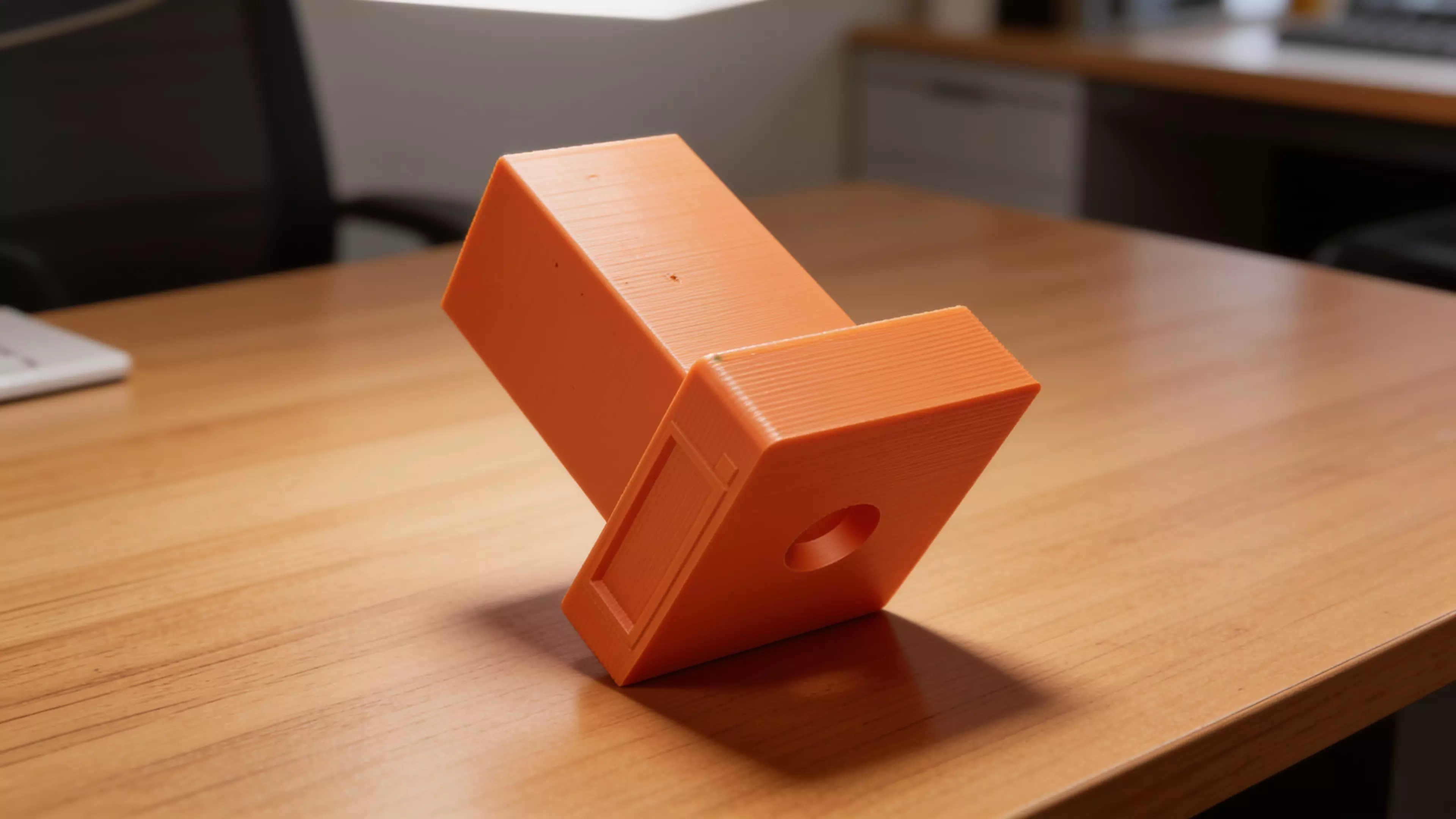 A retro-terminal desk holder: a low, wide CRT-monitor-bezel plinth (complete with a
recessed screen panel and a debossed > prompt) with an oversized rectangular
text-cursor block rising from its top like a frozen "on" blink. Five blind holes
of increasing diameter are drilled into the block's top face in a diagonal,
back-left-to-front-right layout, each sized and chamfered for a specific
implement — stylus, pen, pencil, marker, highlighter. Single piece, flat-bed
print, no supports.