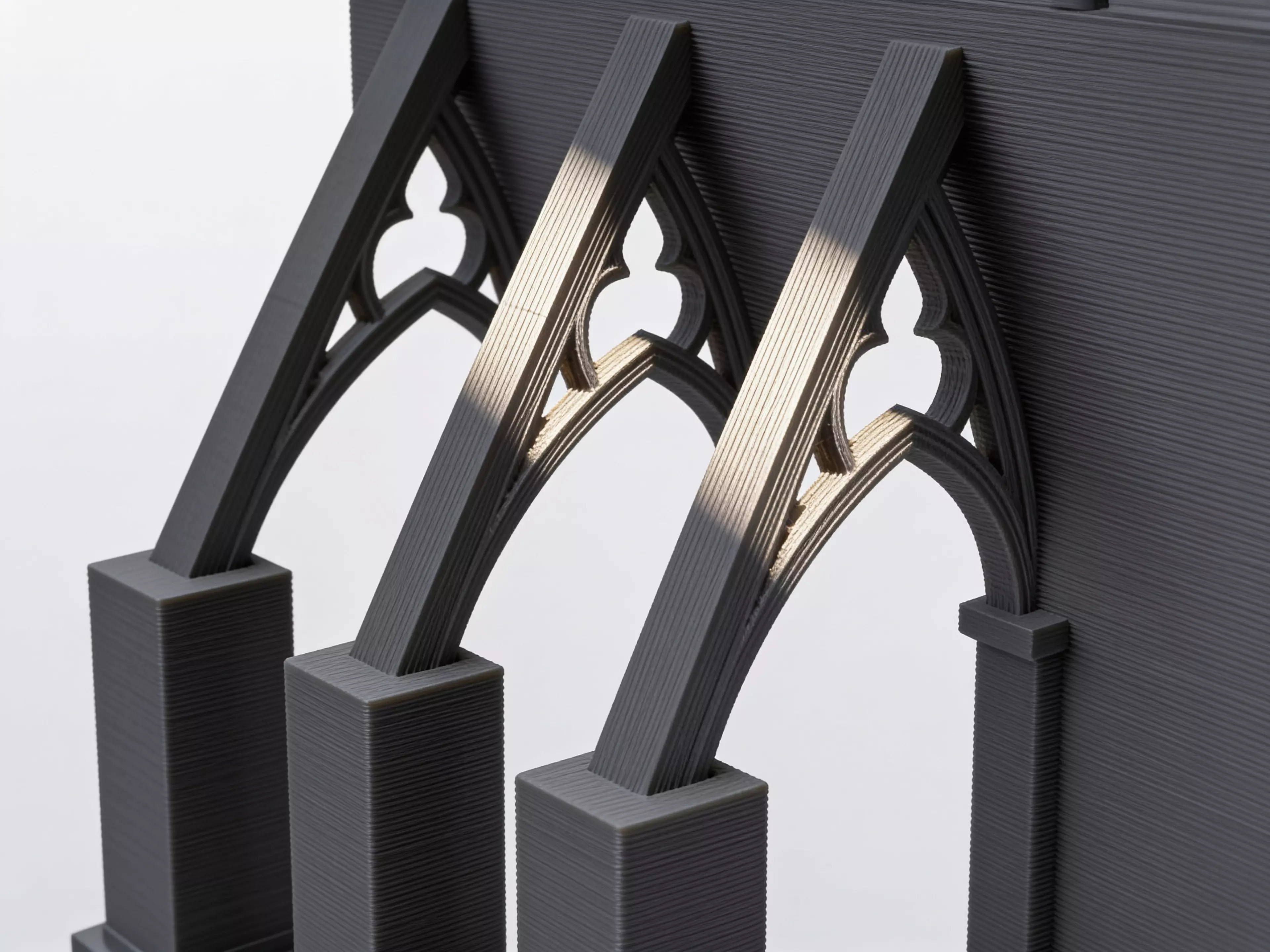The Calibration Cathedral is a Gothic micro-cathedral that is secretly a complete FDM torture test: self-supporting pointed-arch windows, a graduated flying-buttress overhang staircase, tapered spires and pinnacles for bed adhesion and fine detail, a bridging rose window, a print-in-place captured…
