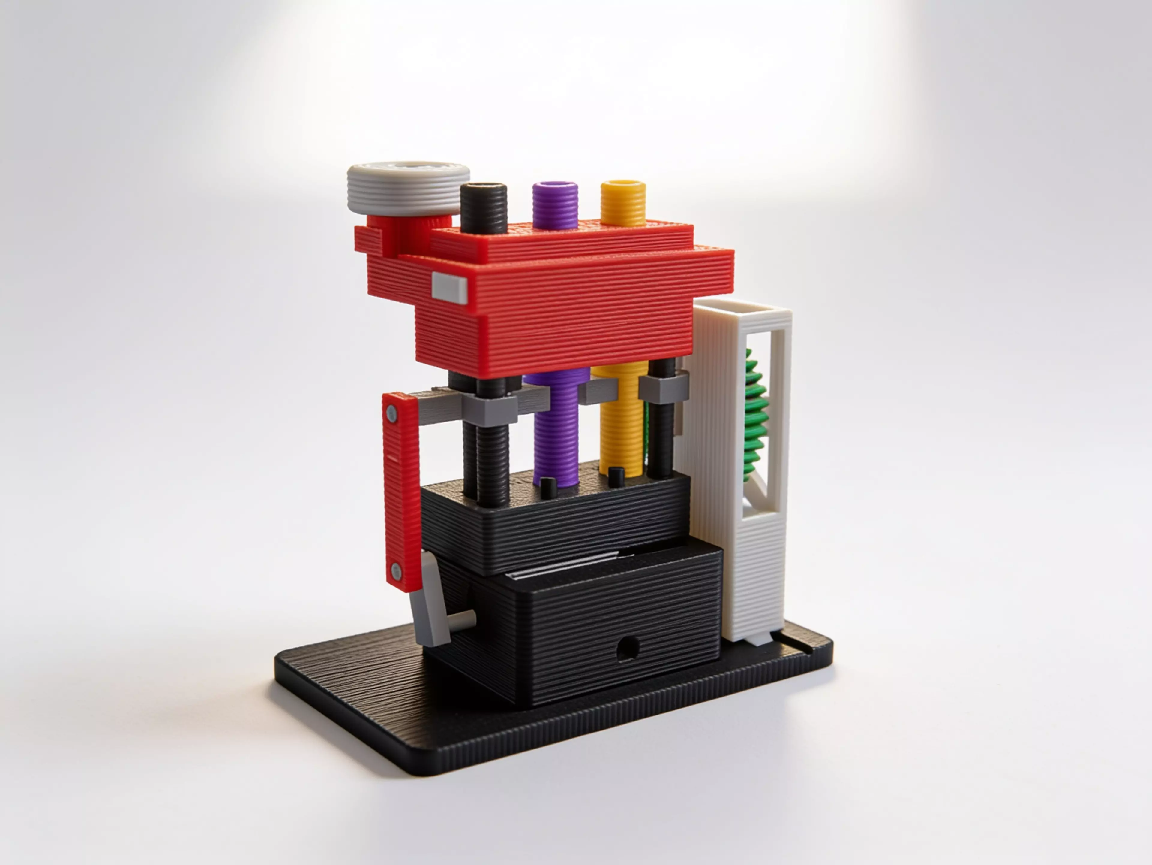Rod-Drop Scram Console. Three grey rods cocked in a black column, white drum reading GREEN. Palm the mushroom — latch slides 0.20 in, rods drop 0.94 in, drum flips to SCRAM.