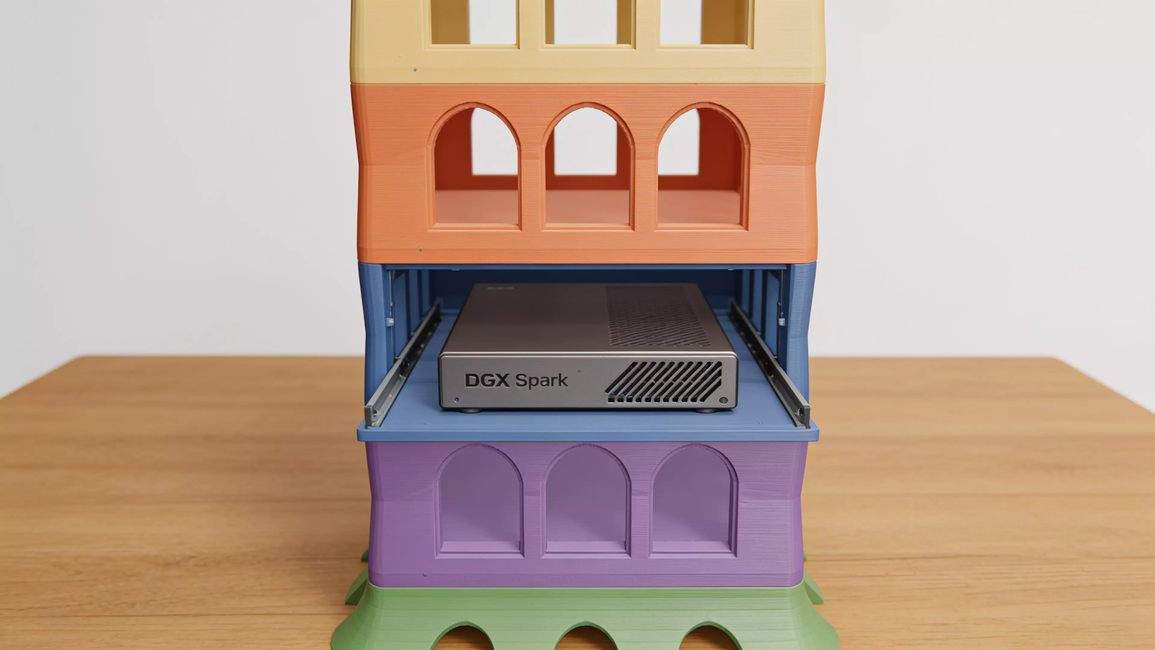 A freestanding 6-piece sculptural tower — splayed organic plinth, four identical catenary-arch bay modules that each cradle one DGX Spark on an open slide-in shelf, and a four-pinnacle parabolic crown — in matte bone-tone PLA, 210 × 170 × 309 mm assembled.