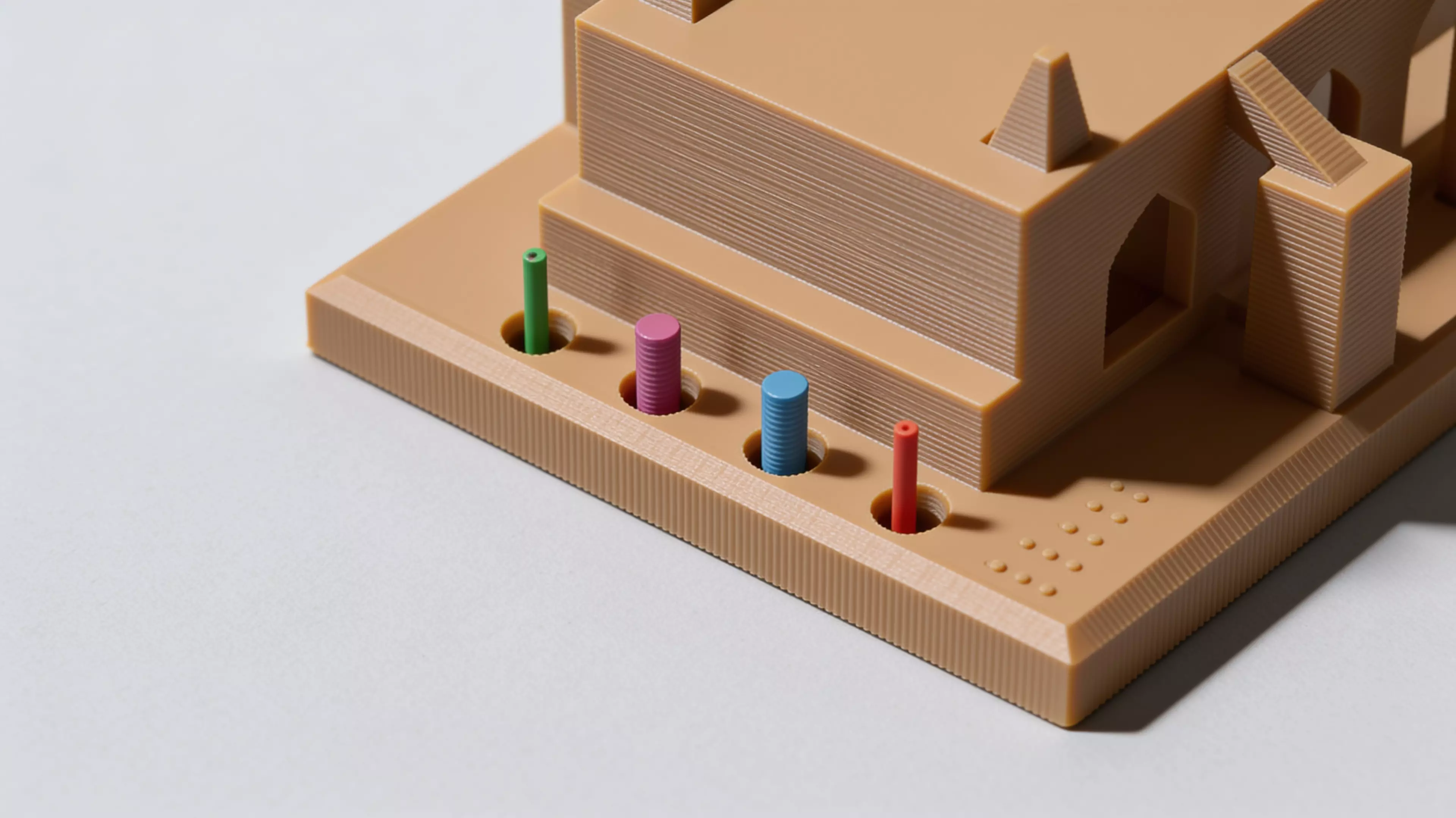 The Calibration Cathedral is a Gothic micro-cathedral that is secretly a complete FDM torture test: self-supporting pointed-arch windows, a graduated flying-buttress overhang staircase, tapered spires and pinnacles for bed adhesion and fine detail, a bridging rose window, a print-in-place captured…
