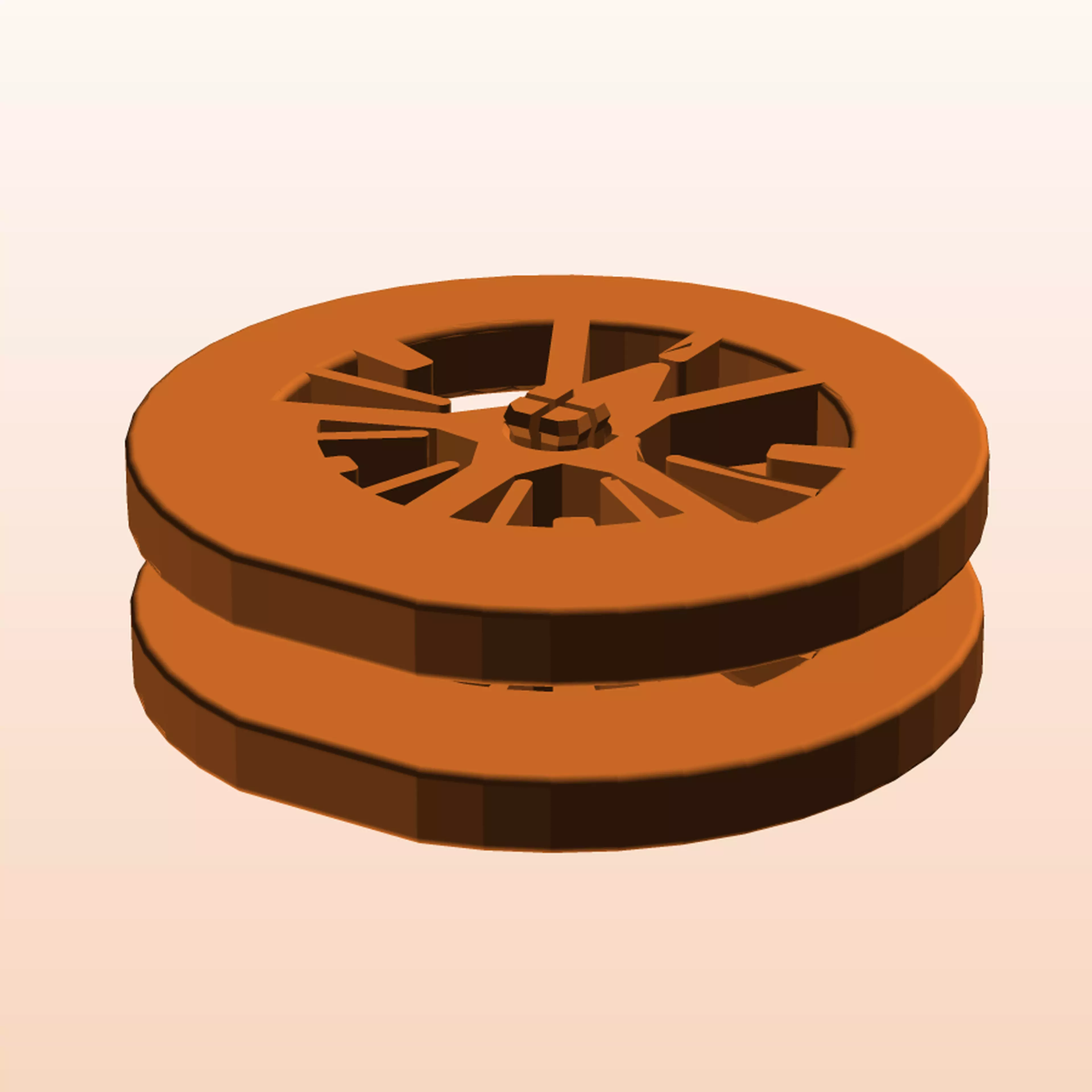 A palm-sized, three-piece kinetic desk spool whose phase-locked ring shell surrounds a captive gravity-lag rotor. At the authored home angle, the rotor's four points meet one fixed crown as a five-point star. The package is digitally verified and explicitly pending physical print and use evidence.