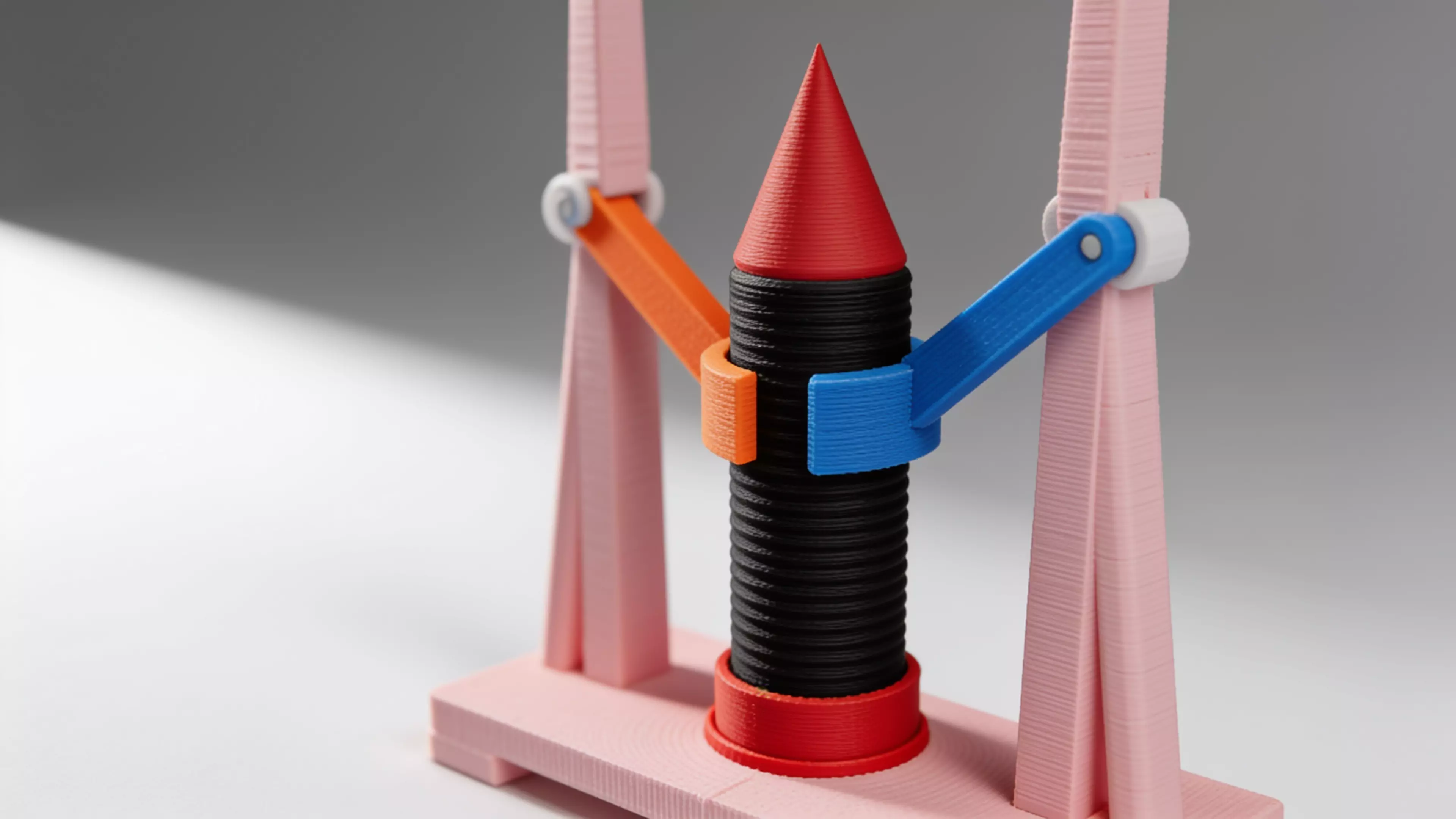 A 180 mm desktop model-rocket-on-launch-tower display: a natural-wood-tone launch tower cradling a removable tan/gray toy rocket, matching the reference photo's craft-model look.