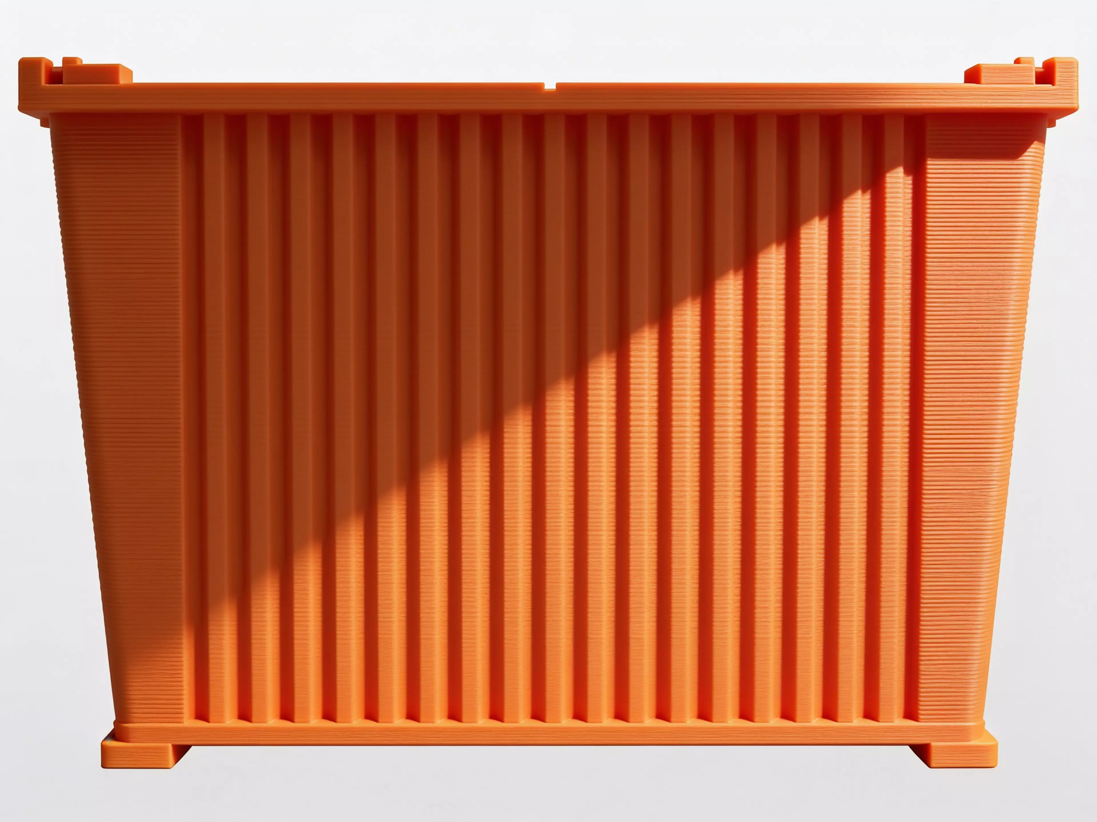 A miniature industrial-dumpster-styled desk trash catcher: a tapered corrugated bin body with two hinged flip lids that meet in the middle, complete with corner skid feet.