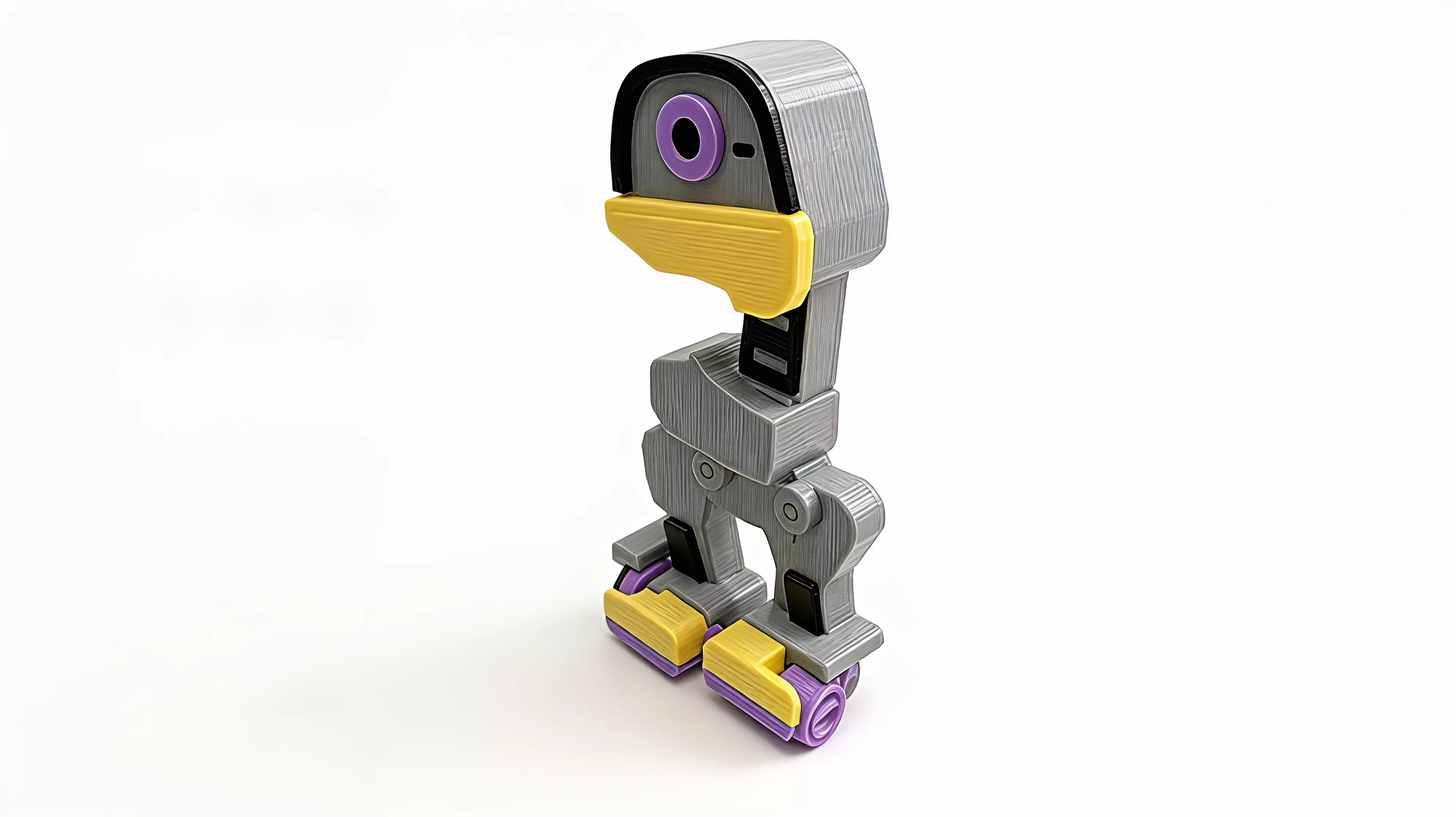 A grey robot duck with a yellow bill, purple details and a side winding knob. A replaceable silicone cord stores the twist that drives its small wheels.