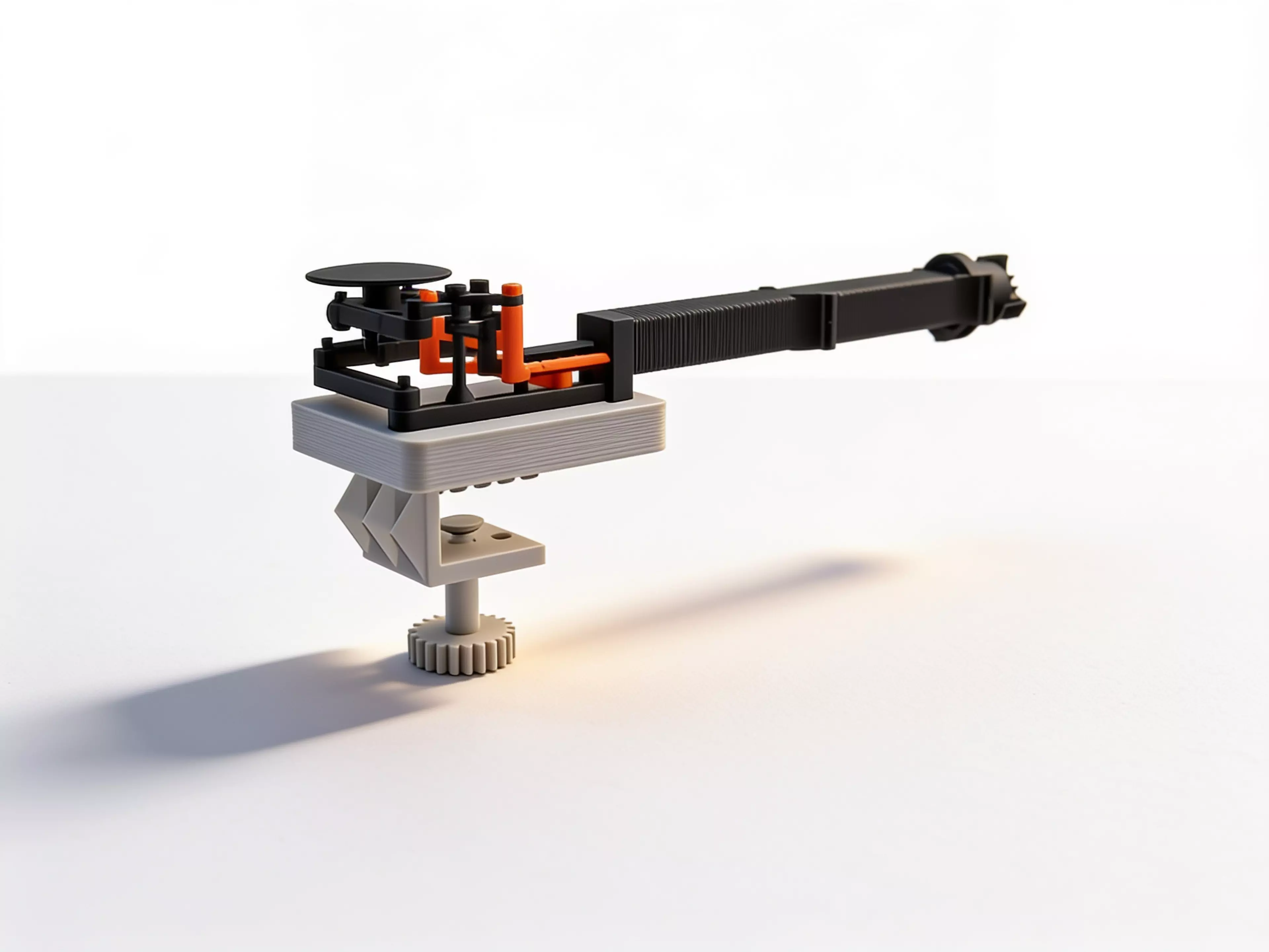 A bench-clamped manipulator that mirrors your hand at 2:1 - squeeze, twist and thumb-push drive a gimballed three-jaw gripper down a stackable boom, for steady, dexterous work inside aquariums, terrariums and tight chassis your hand cannot reach.