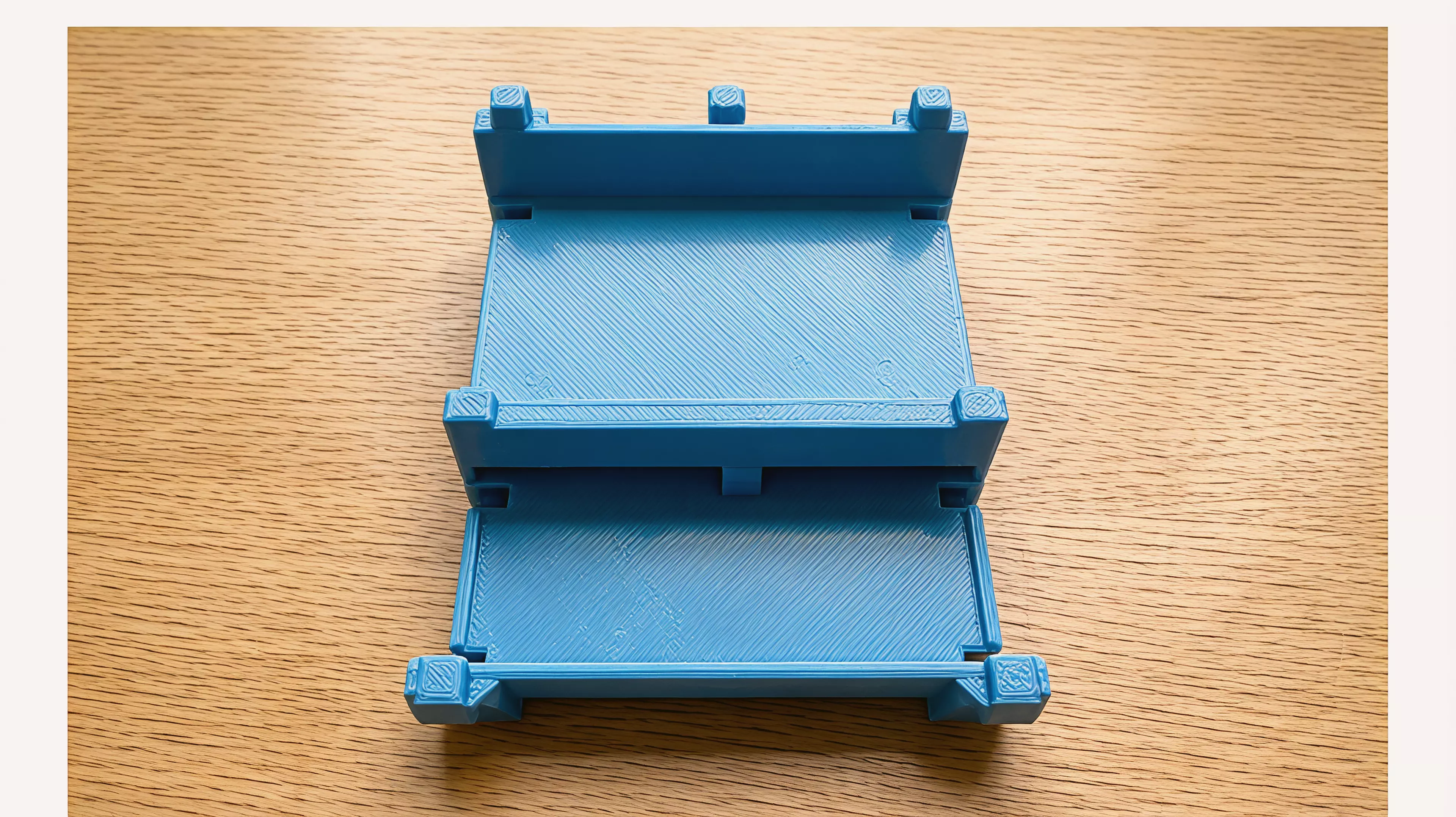 A PETG FDM knock-down rack holding 2 NVIDIA DGX Spark per tier (2 tiers = 4 devices), built from zero tier-unique parts — 2 end walls + 1 center divider + 2 floor trays per tier, stacked on 8 x 8 mm self-locating chamfered key joints, with 4 press-fit feet and flush top caps, styled as a…