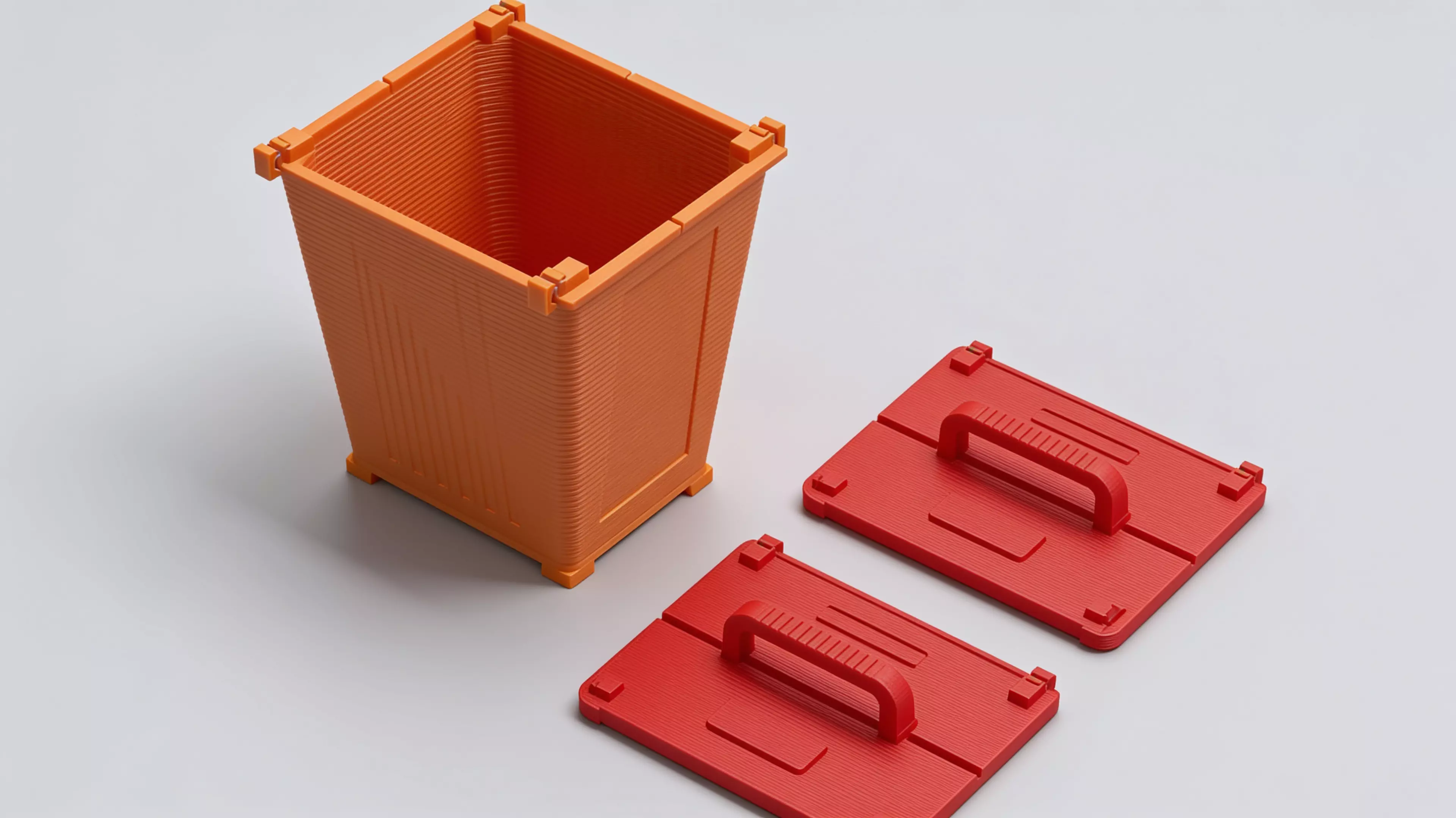 A miniature industrial-dumpster-styled desk trash catcher: a tapered corrugated bin body with two hinged flip lids that meet in the middle, complete with corner skid feet.