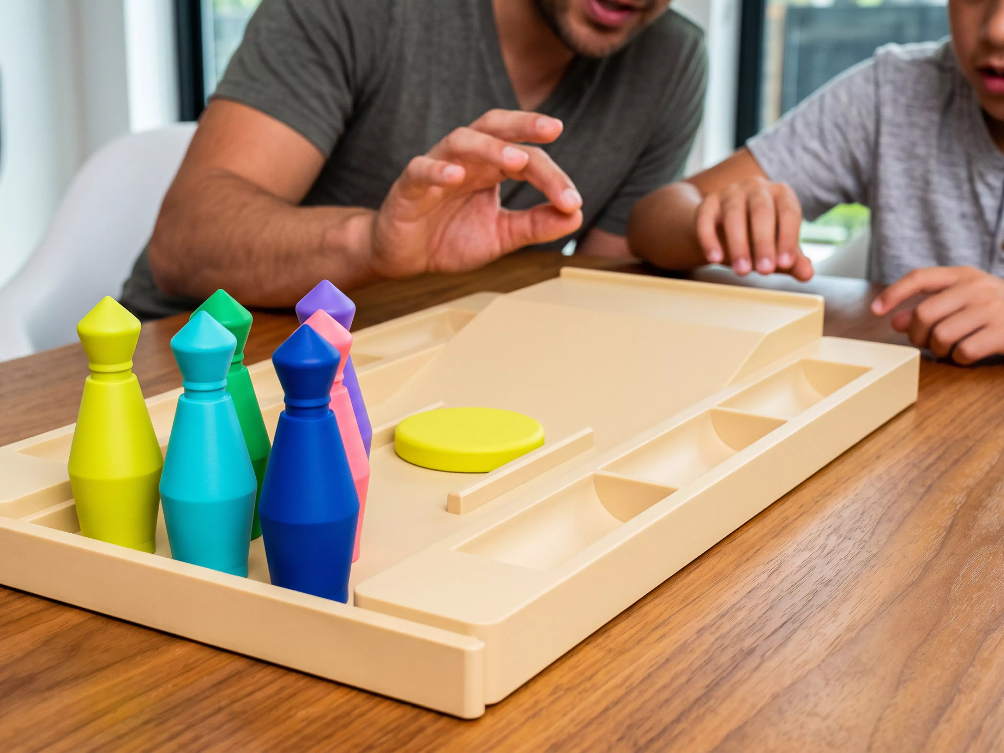 Pocket Bowling Toy: a Lane Tray That Ramps Into a Flick-launch Pad and Doubles A
