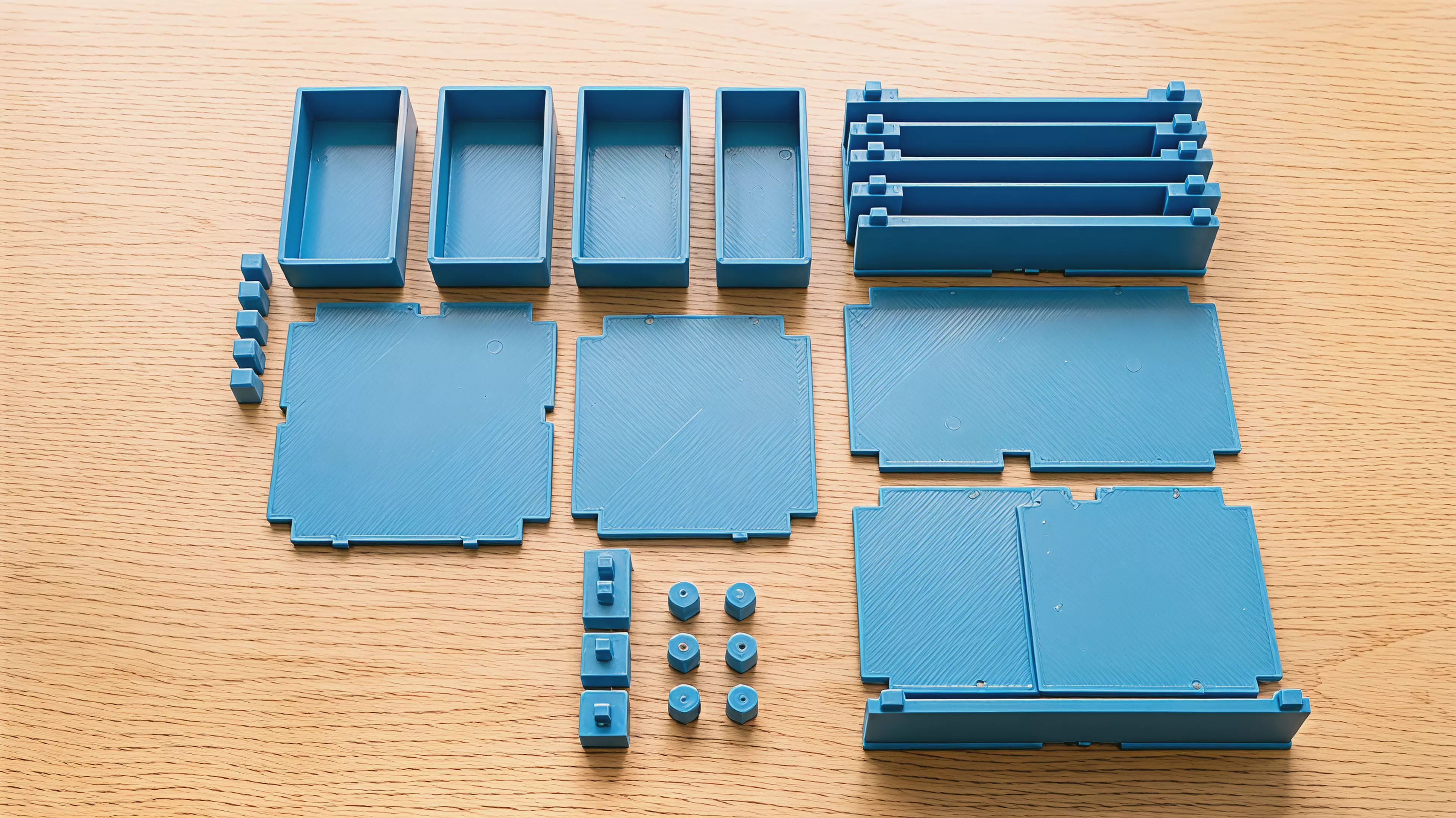 A PETG FDM knock-down rack holding 2 NVIDIA DGX Spark per tier (2 tiers = 4 devices), built from zero tier-unique parts — 2 end walls + 1 center divider + 2 floor trays per tier, stacked on 8 x 8 mm self-locating chamfered key joints, with 4 press-fit feet and flush top caps, styled as a…