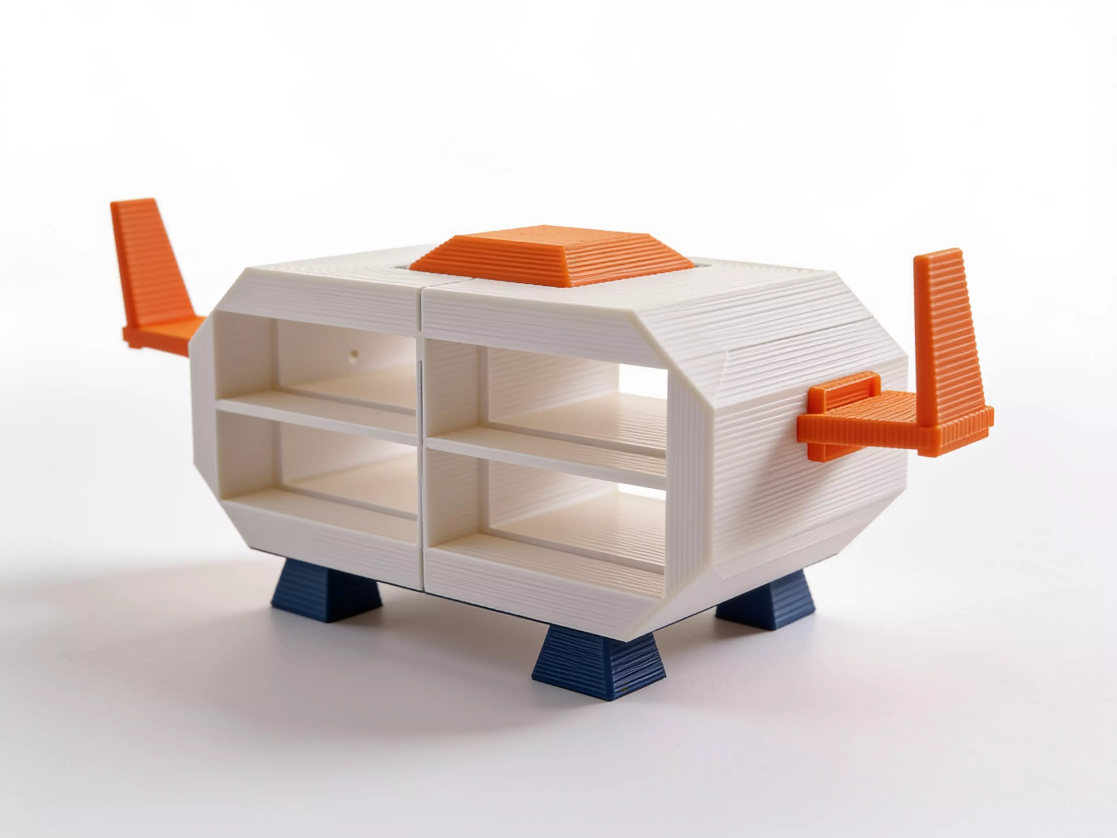 A knock-down sci-fi shuttle enclosure holding 4× NVIDIA DGX Spark in a 2×2 open-ended tunnel grid: two mirror shell halves (split on the central vertical plane), a dark-grey cockpit canopy, two swept blade fins, and four dark-grey landing feet — all M3/dowel assembled, printed without supports.