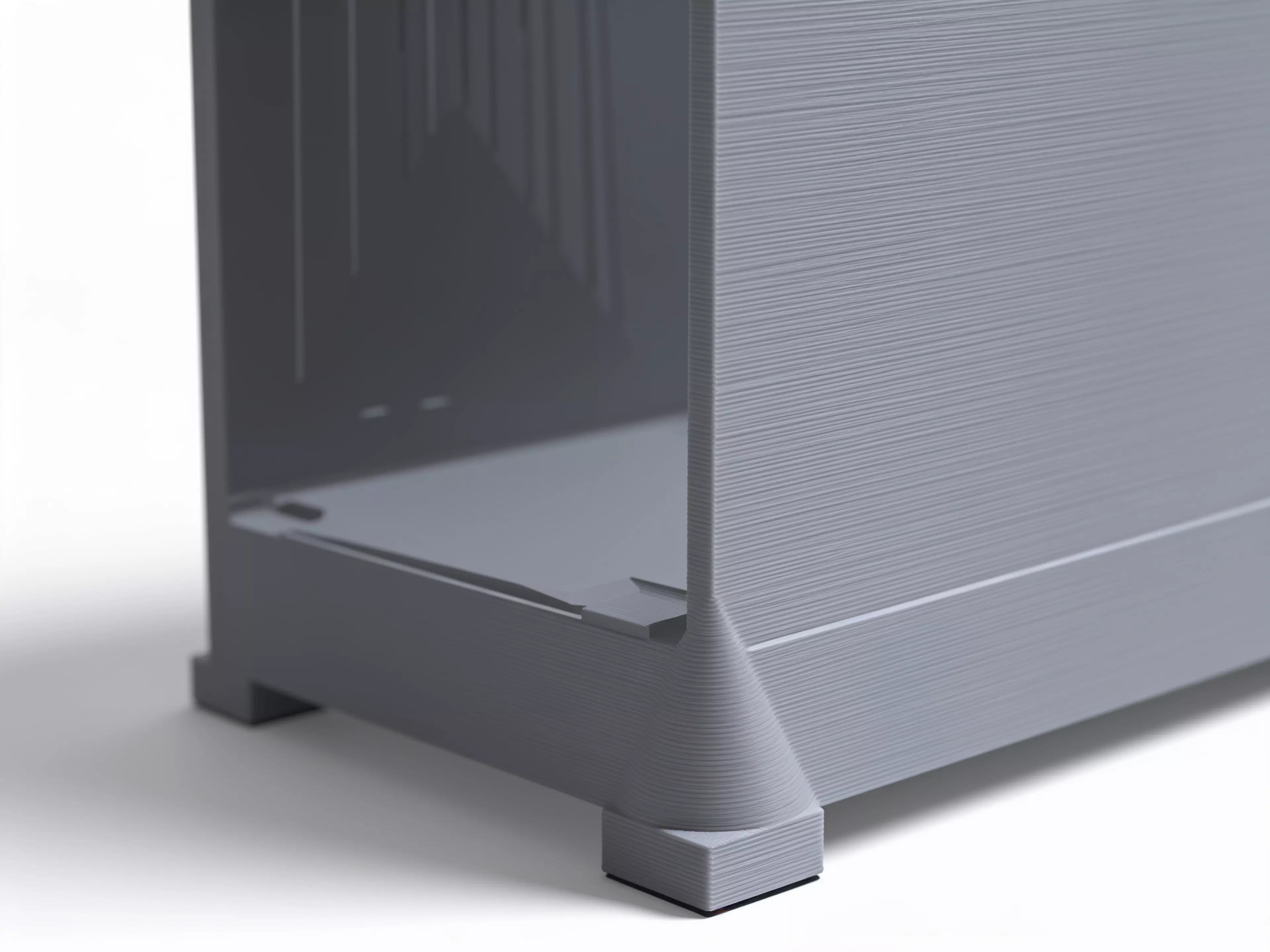 A miniature industrial-dumpster-styled desk trash catcher: a tapered corrugated bin body with two hinged flip lids that meet in the middle, complete with corner skid feet.
