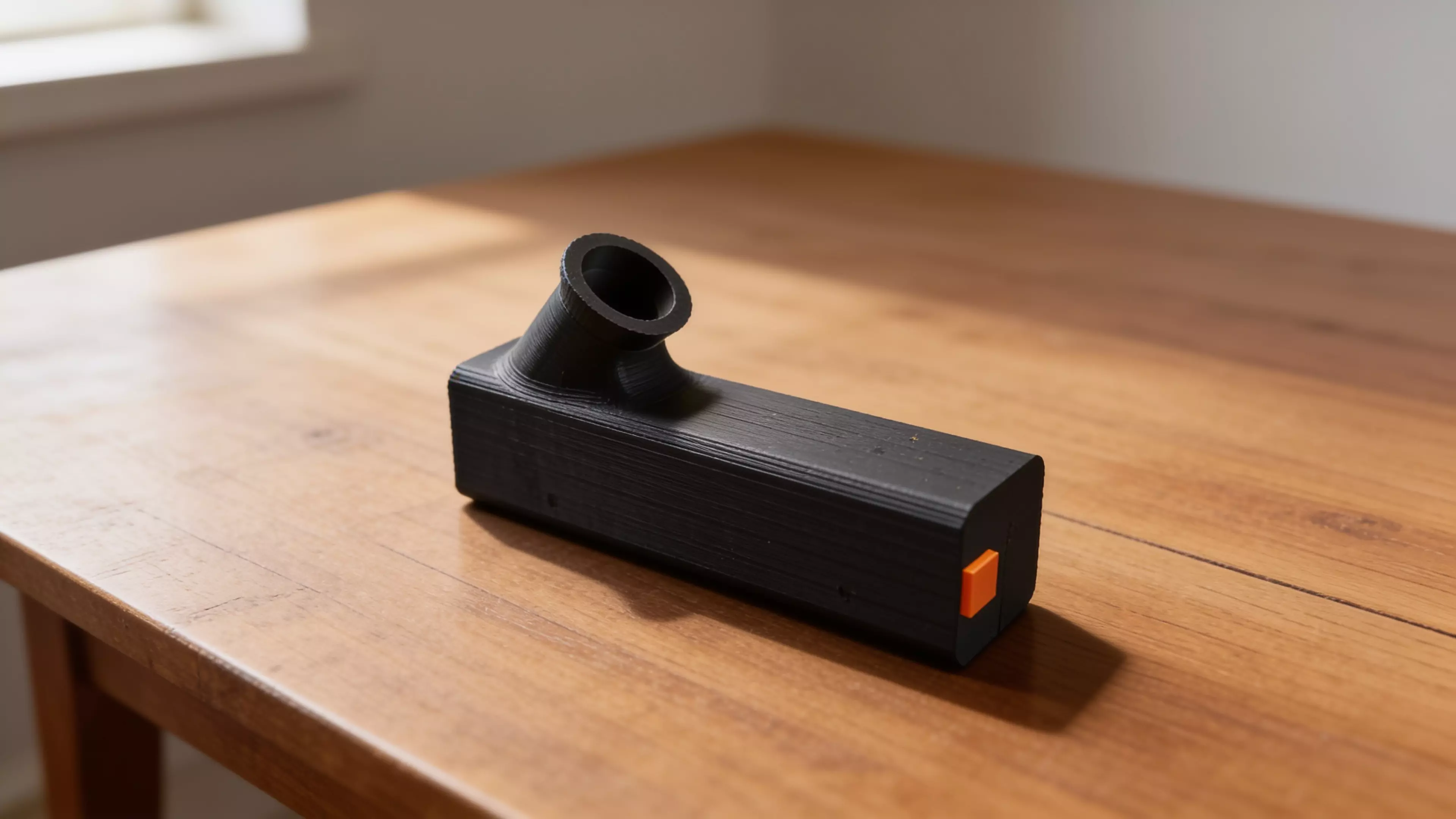 A pocket observatory for eclipse day: point it sunward, shrink the orange tab’s shadow to a dot, and a crisp solar crescent appears on the internal screen — you never look at the sun. Optics-calibrated 0.7 mm pinhole, 55° glare-hooded eyepiece, prints in one piece with zero supports in ~8.5 h. 152 × 38 × 74 mm, PLA.