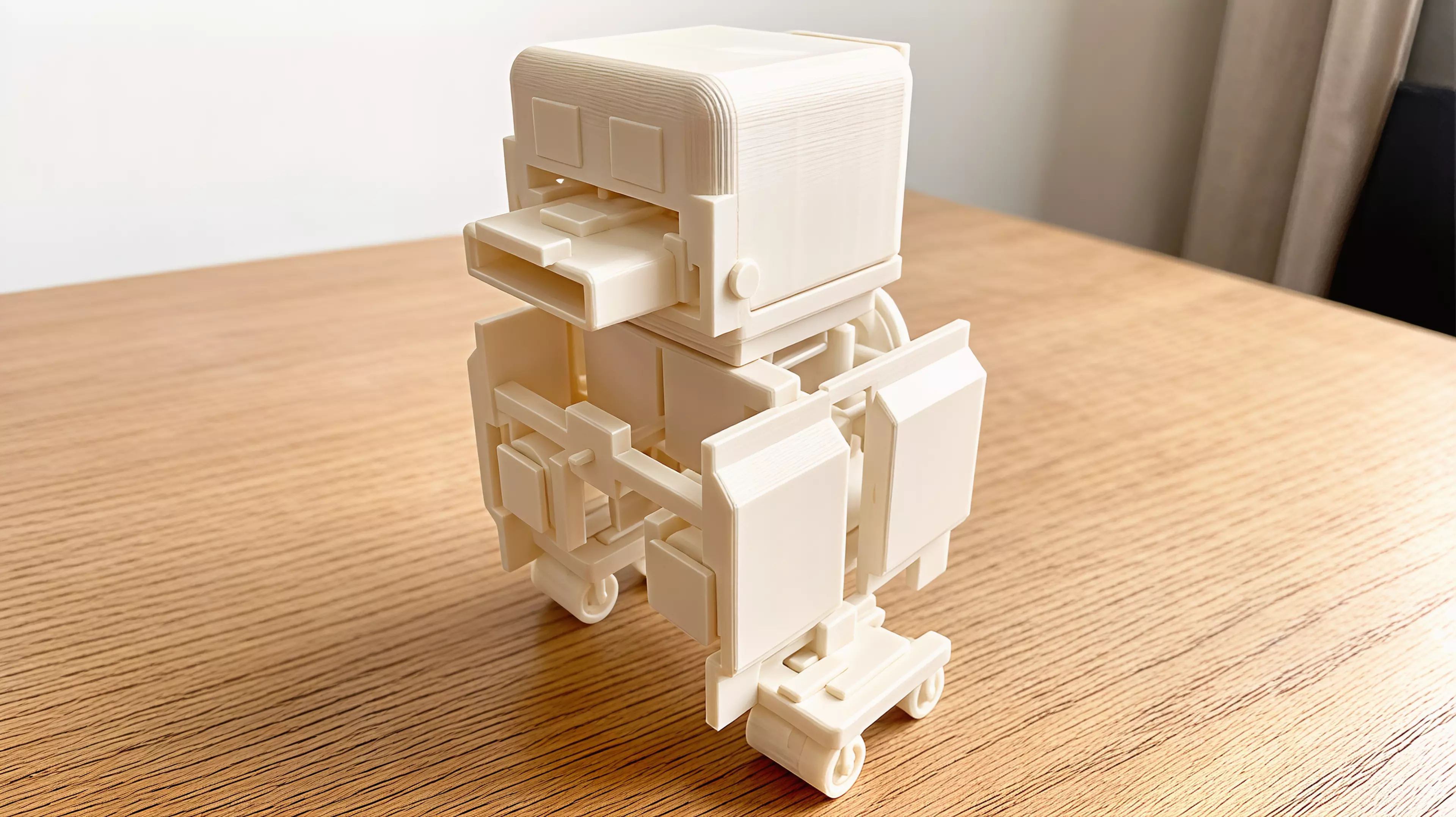 An original palm-size all-printed duck-like desk automaton designed around a visible ring crank, eccentric cam, paired-hip waddle, opening clip beak, rocking belly, keyed eyes, and removable captive-roller skates.