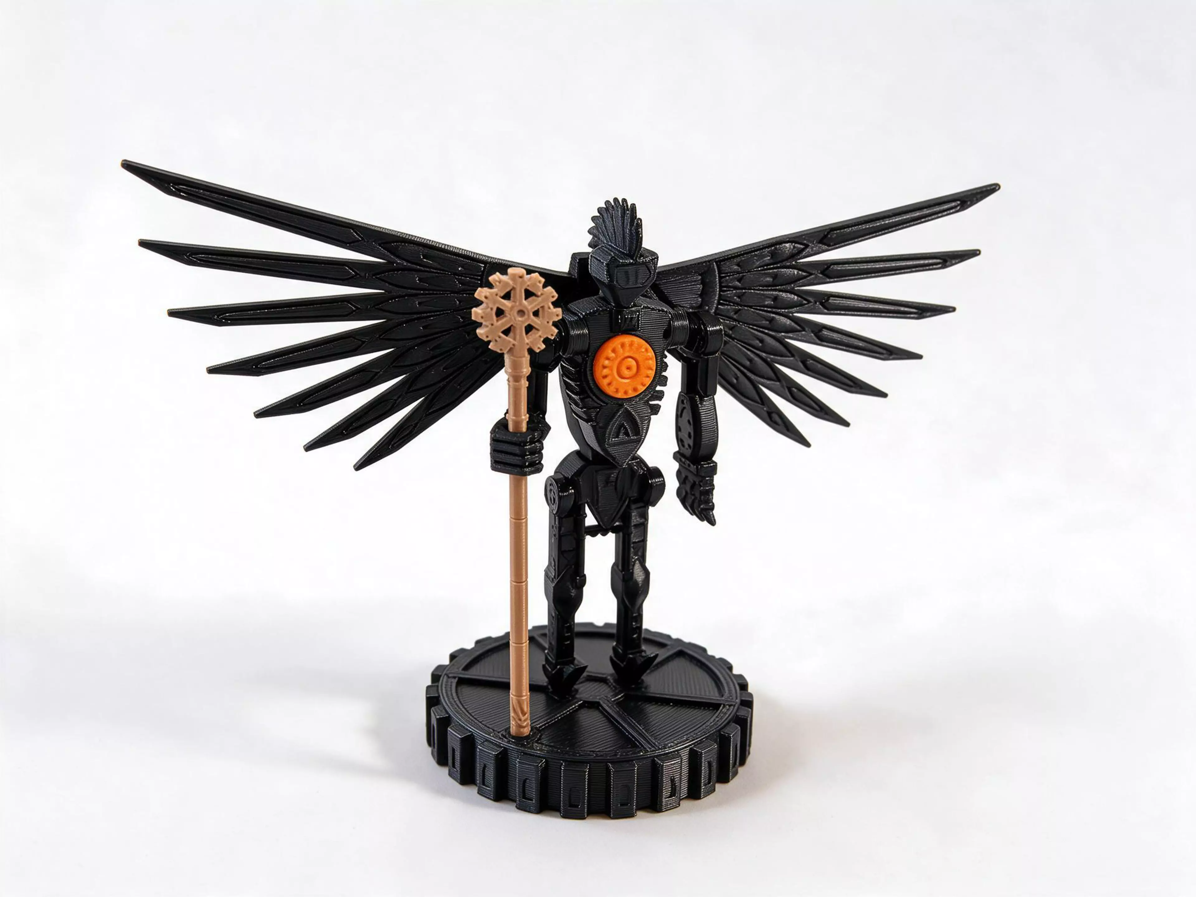 A 180 mm gothic-industrial desk statue of Mekhane, the clockwork Broken God: a skeletal riveted figure with a sunburst gear heart, blade-feather wings, a crested one-eyed helm and a sun-gear staff, standing on a 24-tooth gear pedestal. Turn the heart 60 degrees and a hidden gear train swings both wings 40 degrees, from folded to a wide open V, clicking into place at each end. This revision of Broken God v02 rebuilds the left arm alone: it is now 62 mm long with its claw tips at Z 79, and the claw is three separate segmented fingers that curl inward to hooked tips instead of one flat slab. Every other part is unchanged from v02.