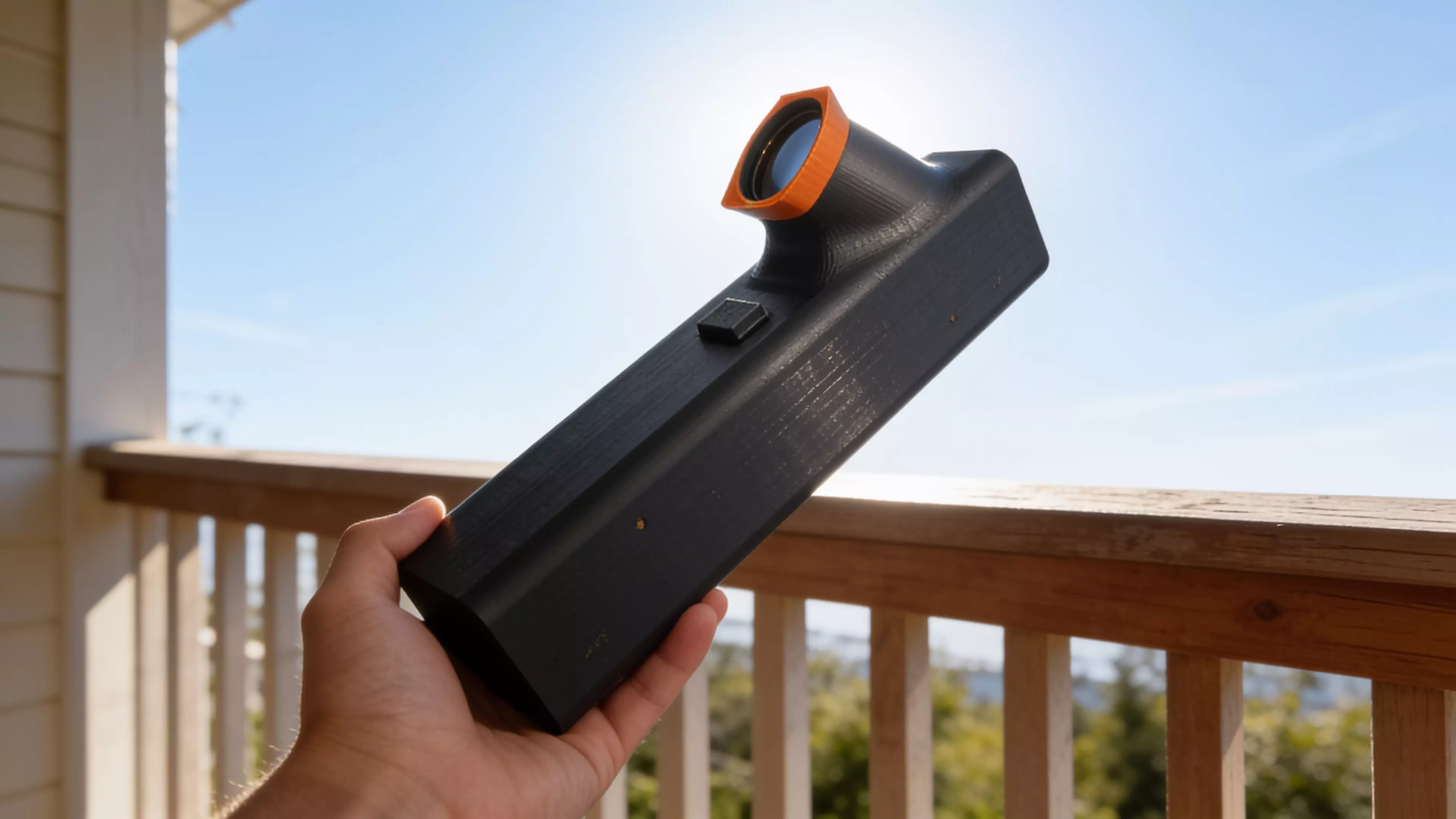 A pocket observatory for eclipse day: point it sunward, shrink the orange tab’s shadow to a dot, and a crisp solar crescent appears on the internal screen — you never look at the sun. Optics-calibrated 0.7 mm pinhole, 55° glare-hooded eyepiece, prints in one piece with zero supports in ~8.5 h. 152 × 38 × 74 mm, PLA.