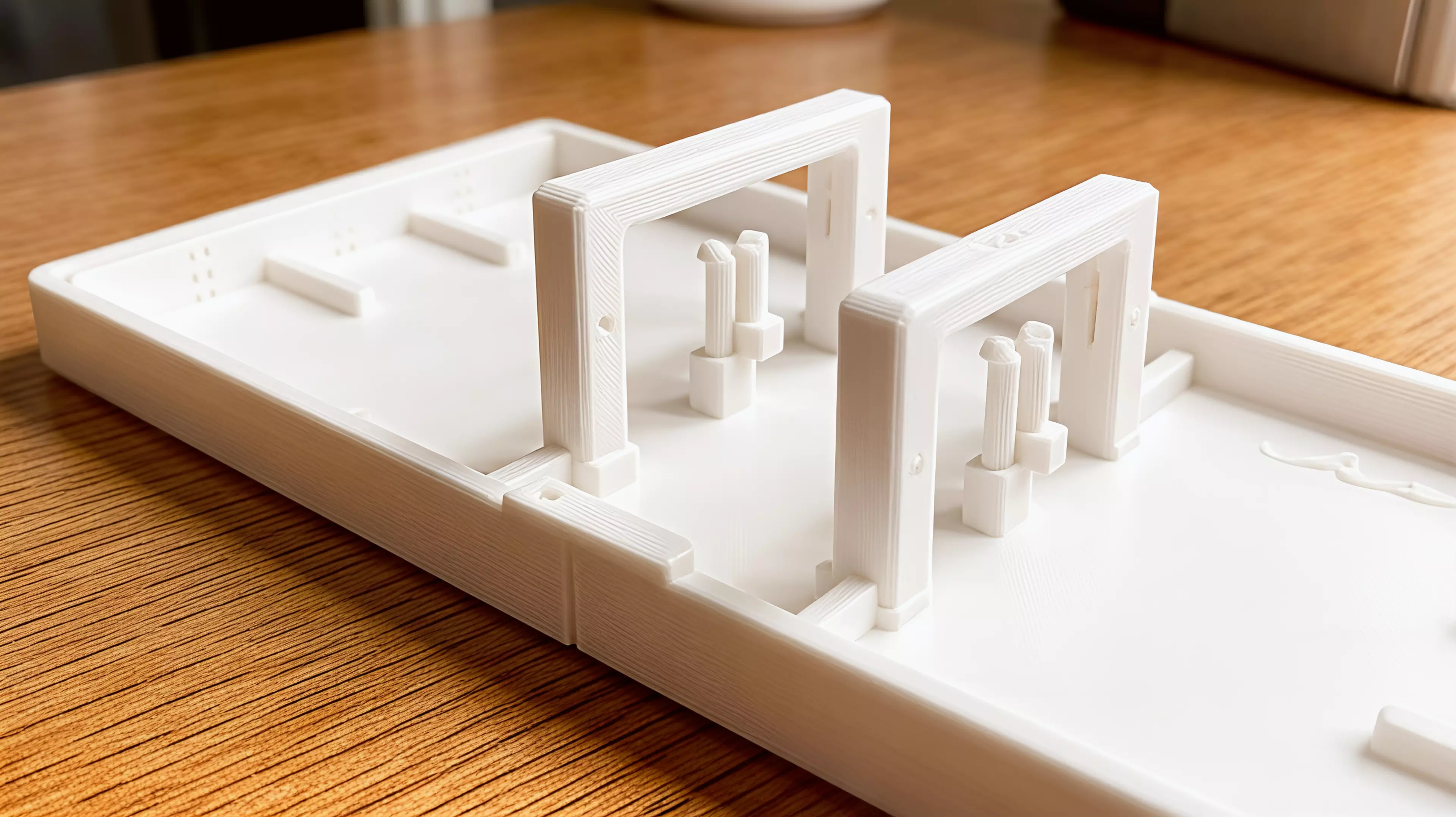 A portable, all-printed tabletop dexterity game for one or two players: pulse two gravity gates, flick a comet through both portals, and bank into pip-marked vaults across six shots.